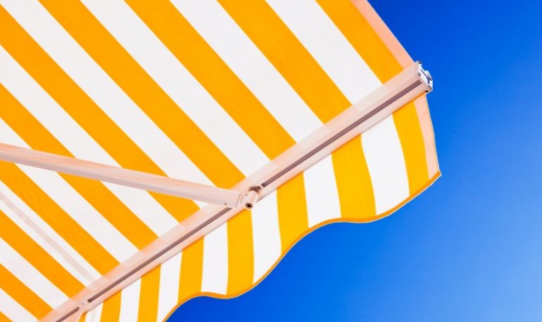 Choosing the Right Awning Fabric: Durability, Color, and UV Protection